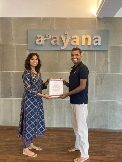 A moment of pride and accomplishment for a newly certified yoga teacher from our 200-hour program.