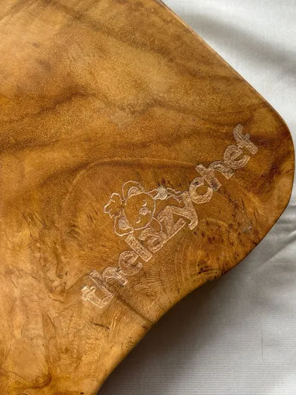 My engraving isn't just for glass and metal. I love the challenge of working with different textures, like this beautiful wooden cheeseboard. I personalized it with a custom logo for 'thelazychef', and I'm obsessed with how the natural grain of the wood makes the design pop.