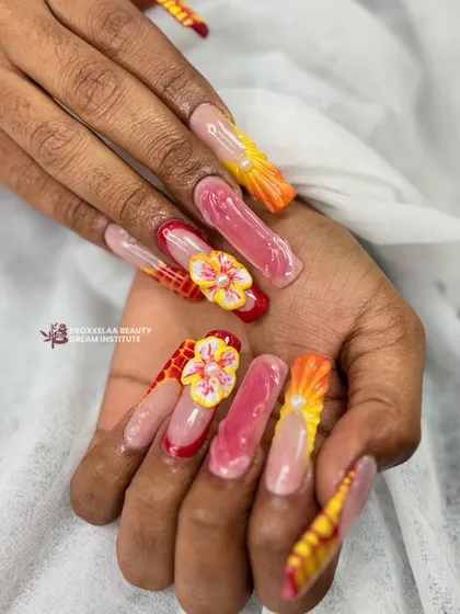 A different perspective on the vibrant, multi-textured 3D nail set, showing how the different elements come together to create a cohesive and eye-catching design.