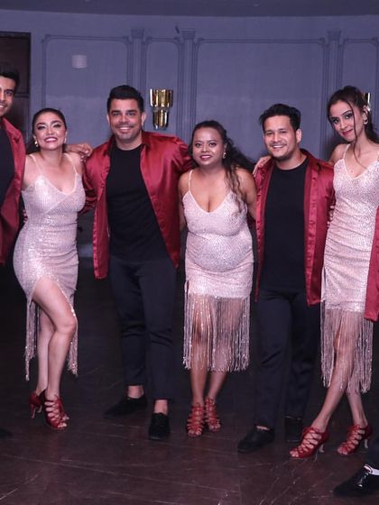 A group photo of our performance team, all smiles after lighting up the stage. Joining our team is a great way to take your dancing to the next level and make lifelong friends.