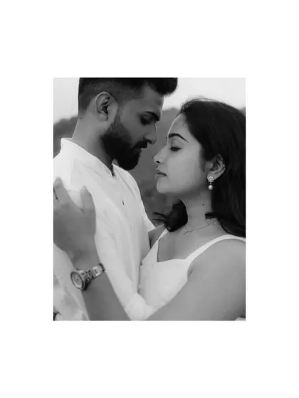 An intense and intimate black and white portrait. This close-up of Treesa and Justin from their misty mountain shoot focuses on the deep, soulful gaze between them.