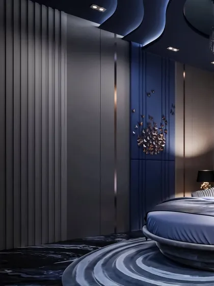 This angle focuses on the custom wall paneling and a metallic art installation, showcasing a blend of texture and sculptural form.