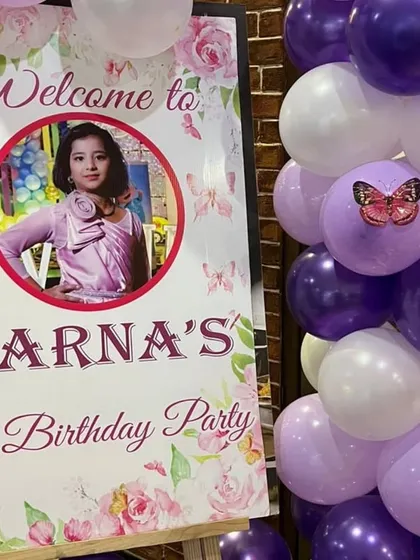 A close-up of the custom welcome sign for 'Aarna's 10th Birthday Party'.