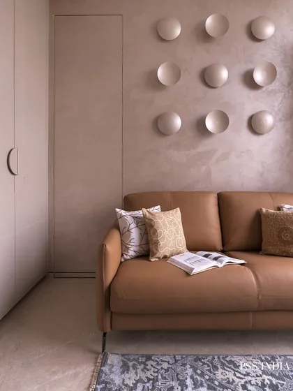 This bedroom is an exercise in soft luxury. I used a palette of grounded neutrals and sculpted textures, like the backlit concave discs on the wall, to create a space that feels both artistic and deeply calming.