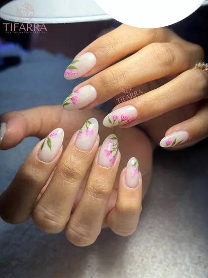 A full view of the elegant hand-painted tulip nails.