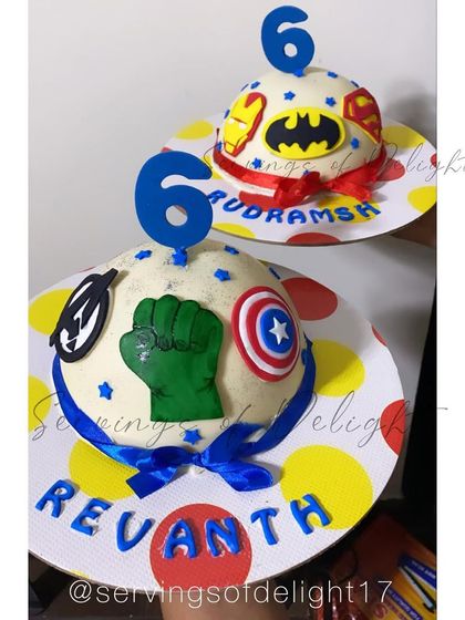 A still shot of the twin Avengers piñata cakes, ready for the birthday boys to smash open.