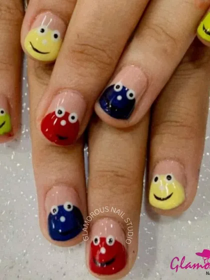 Bring a smile to your day with these fun and colorful nails. Each nail features a different colored smiley face, hand-painted for a playful look.