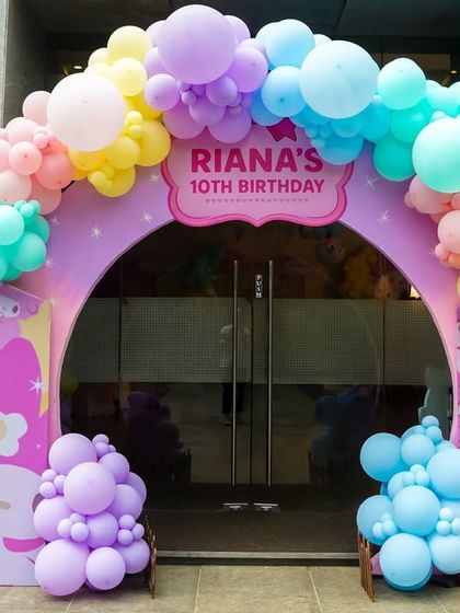 A beautiful pastel balloon arch frames the entrance to this Hello Kitty & Friends birthday party.