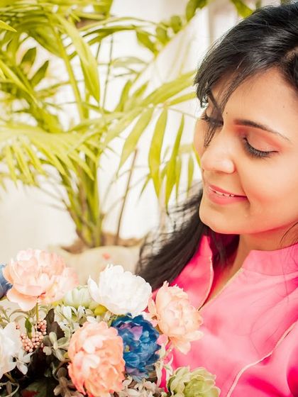 A soft and gentle portrait with flowers. The natural elements and serene expression create a beautiful and peaceful image.