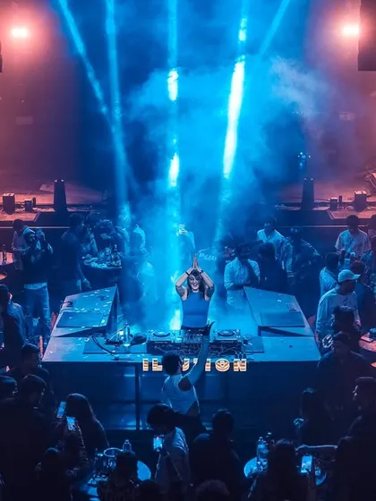 Commanding the stage under dramatic spotlights. Whether it's an intimate club or a large-scale venue, I aim to create a visually and sonically captivating show.