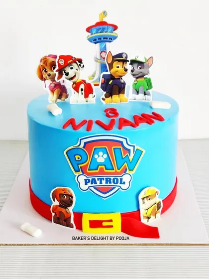 Paw-ty time! This Paw Patrol cake is ready for action, featuring the whole team of pups and their lookout tower. It's a fun and vibrant centerpiece for a young fan's third birthday celebration.