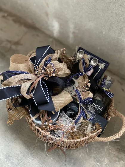 This hamper exudes a classic, masculine elegance with its navy and jute color palette. Containing curated items like a premium bottle and matching accessories, it's an ideal gift for corporate milestones, Father's Day, or a gentleman's birthday.