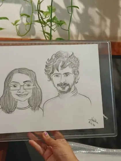 A duplicate image showing the detail of a hand-drawn couple's caricature.