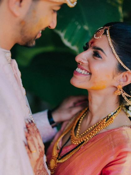 A beautiful candid moment showing the couple's genuine smiles and easy chemistry.