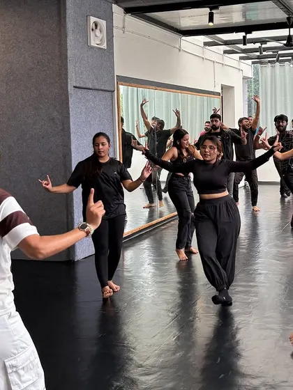 Guiding my students through a hip-hop bhangra routine. My workshops are hands-on, and I make sure everyone gets the steps right.