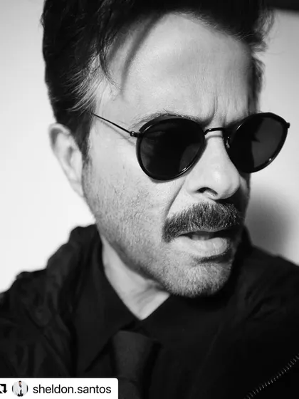 A powerful black and white portrait of Anil Kapoor. The hairstyle adds to the dramatic and intense mood of the photo.