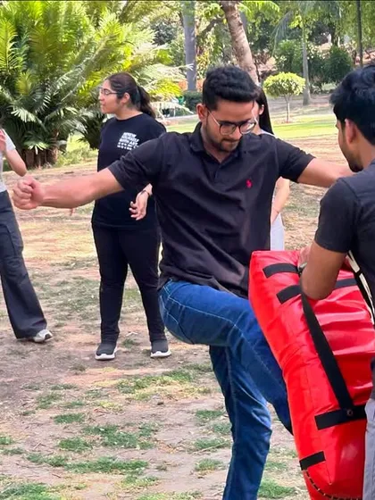A student practices a knee strike during our workshop. The knee is a powerful weapon, perfect for close-quarters defense.