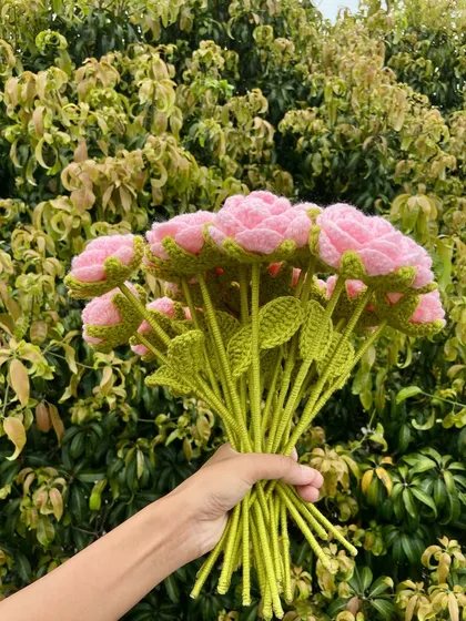 A handful of the pink rose stems, showing their length and detail.