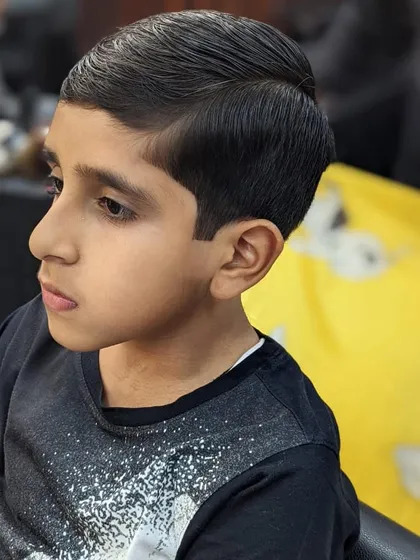 The final look of a very dapper young client. It's a classic, smart haircut that will never go out of style.