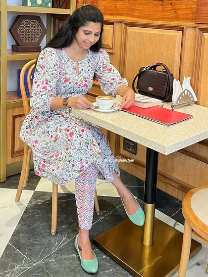 Enjoying a quiet moment in my bestselling floral kurta-pant set. Its timeless style and versatile design make it a go-to for any day.
