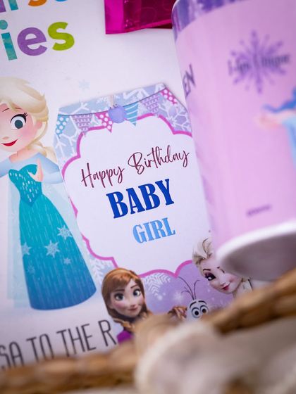A close-up of the 'Happy Birthday Baby Girl' tag, adding a final personalized touch to the gift.