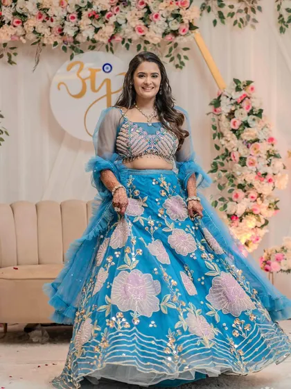 Jinal looked like a princess in her magnificent blue lehenga. I created a look with soft, shimmery eyes and a pink lip to complement the floral embroidery on her outfit.