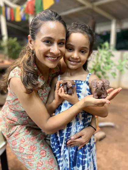 There is nothing more special than creating together. Our parent-child workshops are filled with laughter, play, and the magic of making memories. Here, a mother and daughter proudly show off the little clay elephants they sculpted by hand.