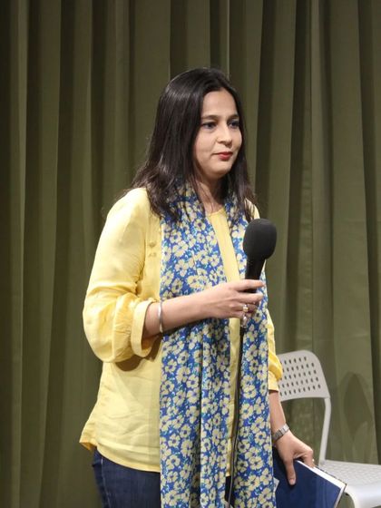 A storyteller captivates the audience with her narrative. Our space is ideal for intimate literary and performance events.