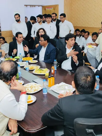 Sharing a meal with judges and lawyers at the farewell lunch. These informal interactions help foster a collaborative and respectful environment.