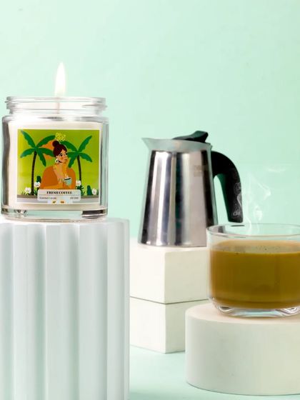 To capture the essence of a coffee-scented candle, I styled it with a moka pot and a steaming cup of coffee. The composition is a sensory delight, perfectly visualizing the aroma for coffee lovers.