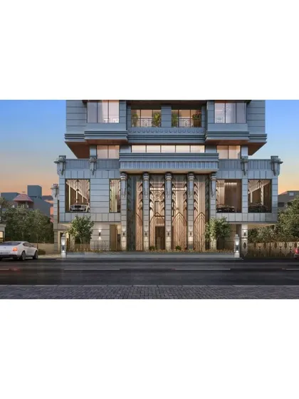 The grand entrance of our Mumbai high-rise, designed to feel like a work of art. The towering, ornate metalwork and double-height glass create a powerful first impression of luxury and craftsmanship.