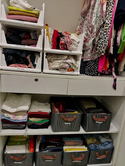 Imagine opening your closet to this level of calm every day. By using a combination of hanging space, stackable bins, and drawer organizers, we created a wardrobe that is both beautiful and highly functional.