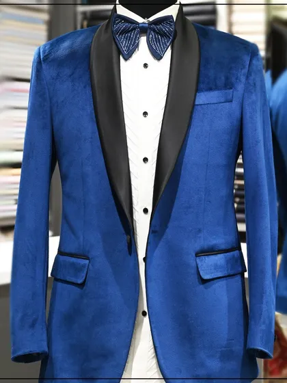 A still image of the blue velvet tuxedo, highlighting the rich color and the contrast of the black lapel.