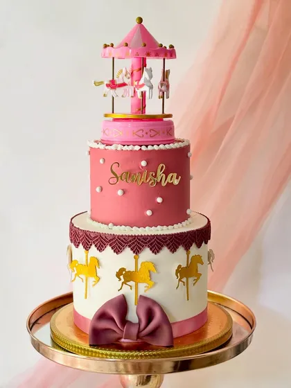 For a grand celebration, I created this three-tiered carousel cake. It features intricate lace piping, golden horse silhouettes, and a functioning miniature carousel on top, combining classic elegance with a touch of whimsy.