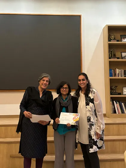 An educator proudly holds her leadership course certificate, standing with our founder and program facilitator. We celebrate every milestone in our team's professional development journey.