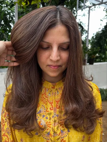This custom color is what I call 'Iced Mocha Frappuccino'. It’s a cool, ashy brown with very fine, subtle highlights that give it a modern and chic vibe. Perfect for someone who wants a change without being too loud.
