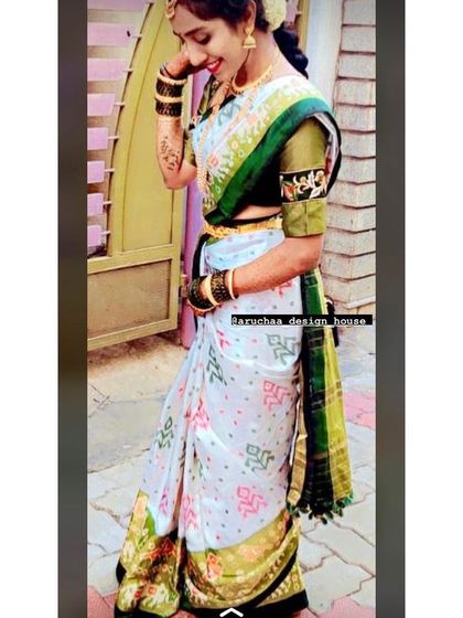 A candid moment showing how the custom blouse complements the bride's entire look. The sleeve embroidery adds a personal touch to her traditional wedding day attire.