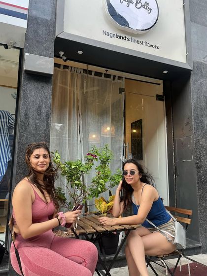 Two friends enjoying their time at our outdoor seating. It's a joy to provide a space where friends can connect over delicious food.