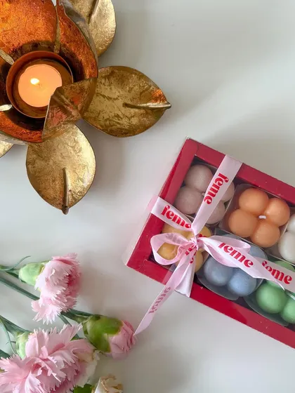 A festive gift box of our mini bubble candles in a rainbow of colors, tied with our signature ribbon. A perfect, cheerful gift for Diwali.