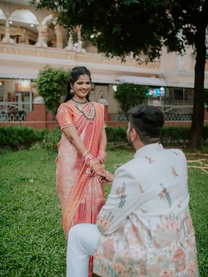The bride-to-be's joyful reaction during the proposal moment of their engagement shoot.