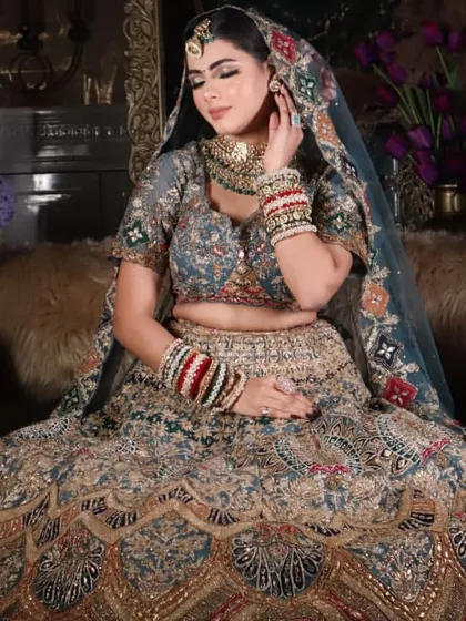 A beautiful portrait of the bride, with the focus on her glowing skin and the rich details of her outfit.