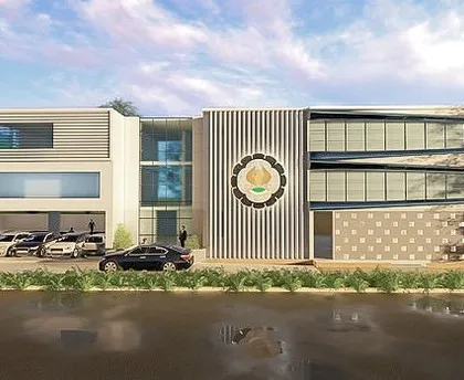 This is the frontal view from a rendering for the Institute of Chartered Accountants of India (ICAI) in Goa. The design aims for a professional and modern look, with clean lines, large glass panels for natural light, and a prominent institutional emblem.