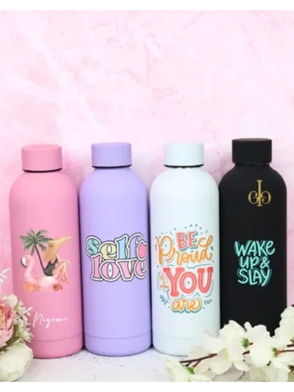 A lineup of our personalized Aqua-Lite steel bottles. These come in various pastel and bold colors and can be customized with fun graphics and names.