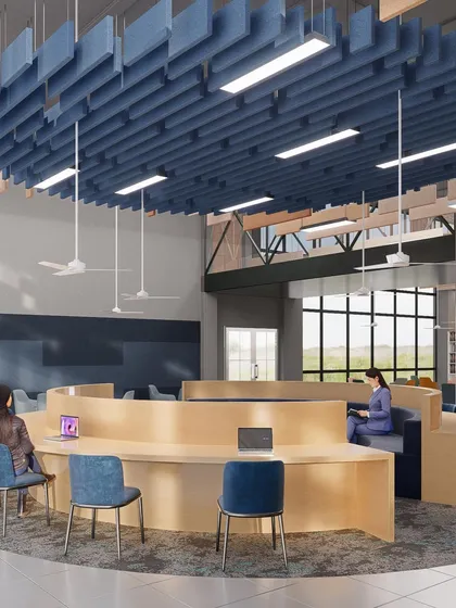 A circular study area within the Amity University library in Hyderabad. The suspended acoustic ceiling feature helps define the zone and manage sound, creating a focused space for collaboration.