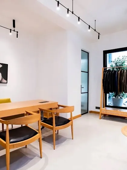 This zen-inspired office uses our Magnetic Modular Lighting System to achieve a clean, minimalist aesthetic. The track lights provide focused illumination on the desk and clothing rack, maintaining an open and uncluttered feel in line with the Wabi Sabi design philosophy.