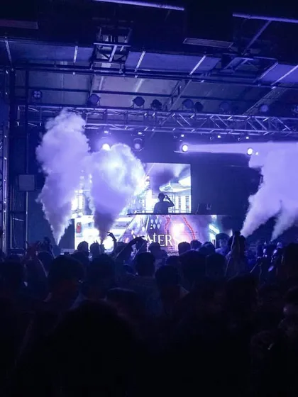 A wide view of the party at Waters, Pune. The custom neon signs and CO2 jets show how I can enhance a venue's existing setup.