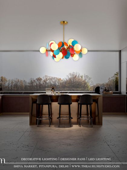 A larger version of the multi-colored disc pendant from ID 55. This fixture is perfect for brightening a larger space with timeless beauty and a dazzling display of light and color.