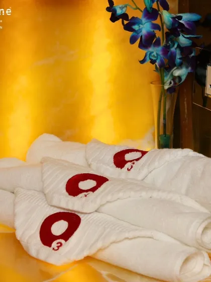 A close-up of my custom-branded towels, neatly rolled and ready for members. This small detail is part of the overall premium experience I strive to deliver every day.