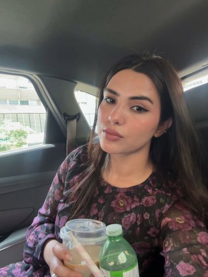 A selfie taken in the back of a car, showing a simple and elegant makeup look. This demonstrates my ability to create quality content even in on-the-go situations.