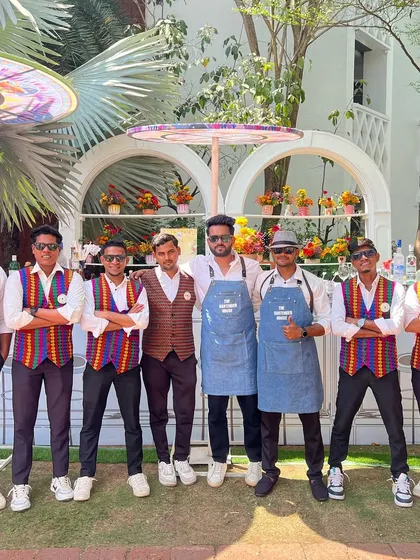 The team striking a pose. We are more than just bartenders; we are the ringmasters of the cocktail circus, here to entertain.